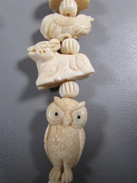 CARVED BONE ANIMAL NECKLACE