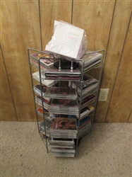 LARGE ASSORTMENT OF CDS ON STAND & EXTRA CASES