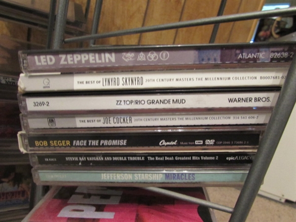 LARGE ASSORTMENT OF CDS ON STAND & EXTRA CASES