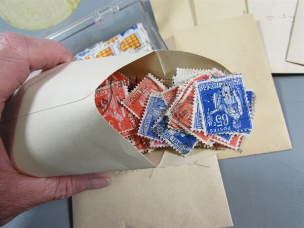 6 SMALL PLASTIC BOXES W/ASSORTED LOOSE POSTAGE STAMPS FOR COLLECTORS