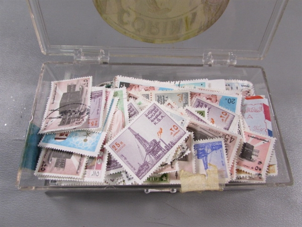 6 SMALL PLASTIC BOXES W/ASSORTED LOOSE POSTAGE STAMPS FOR COLLECTORS