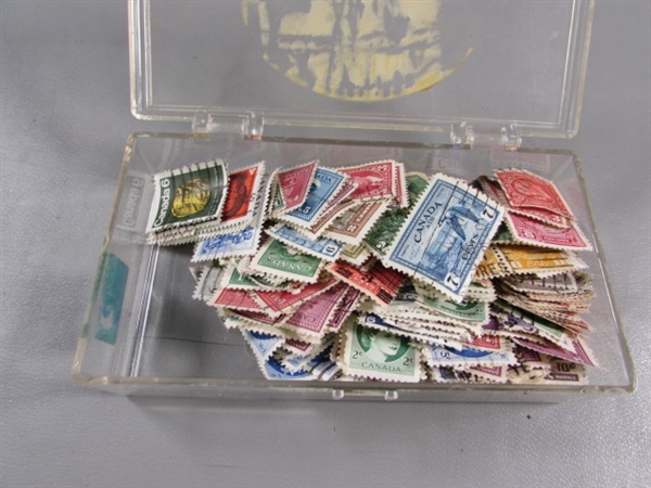 6 SMALL PLASTIC BOXES W/ASSORTED LOOSE POSTAGE STAMPS FOR COLLECTORS