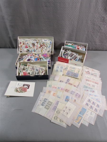 BOXES & GLASSINE ENVELOPES OF POSTAGE STAMPS FROM AROUND THE WORLD