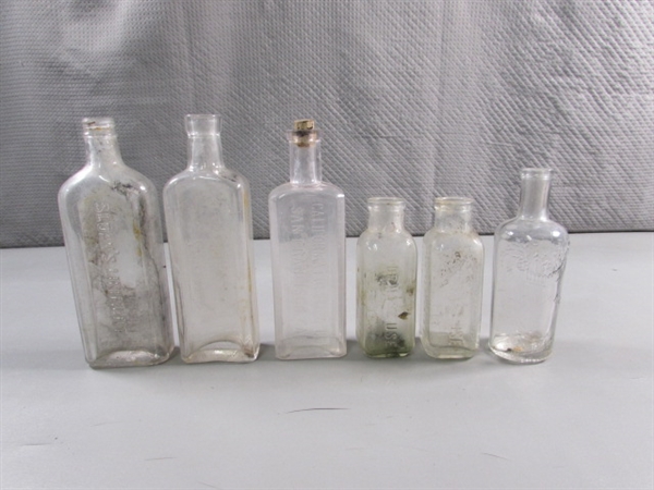 LOT #4 VINTAGE & ANTIQUE CLEAR GLASS BOTTLES W/RAISED LETTERING