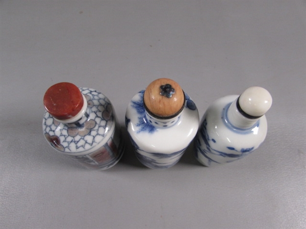 COLLECTION OF SMALL ORIENTAL BOTTLES WITH STONE STOPPERS