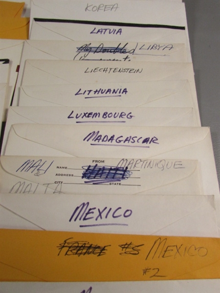 FOREIGN POSTAGE STAMPS - ENVELOPES LABELED W/COUNTRIES D-M