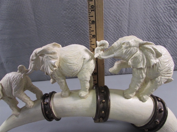 ELEPHANTS MARCHING ON TUSK STATUE - RESIN