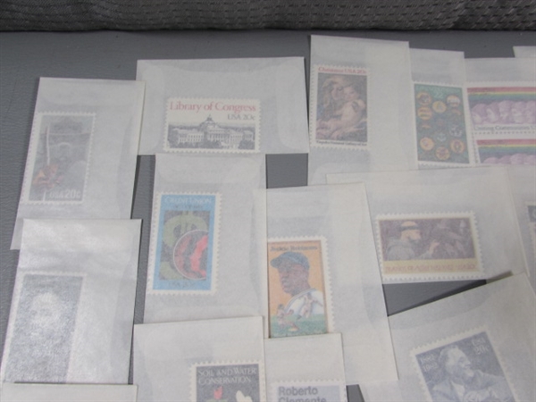 MIXED LOT OF POSTAGE STAMP SINGLES IN GLASSINE ENVELOPES #1