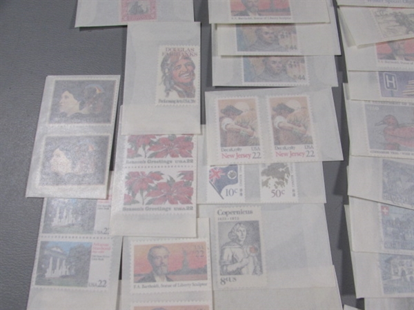 MIXED LOT OF POSTAGE STAMP SINGLES IN GLASSINE ENVELOPES #2