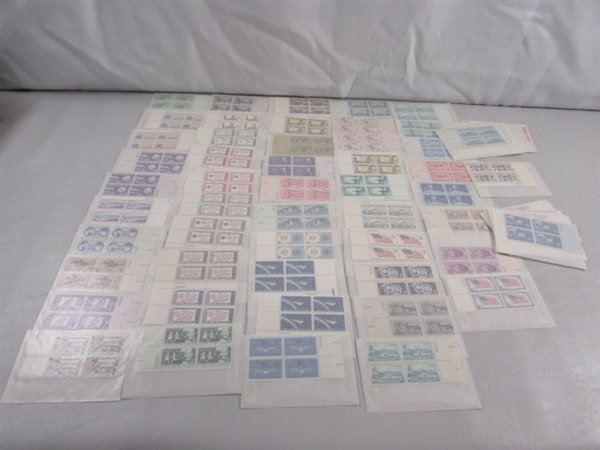 MOSTLY 4 CENT US POSTAGE STAMP BLOCKS IN GLASSINE ENVELOPES-UNUSED