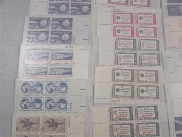 MOSTLY 4 CENT US POSTAGE STAMP BLOCKS IN GLASSINE ENVELOPES-UNUSED