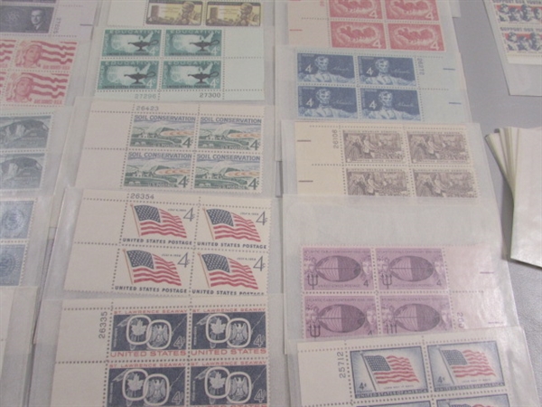 MOSTLY 4 CENT US POSTAGE STAMP BLOCKS IN GLASSINE ENVELOPES-UNUSED