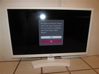 24" LG SMART TV - POWERS ON