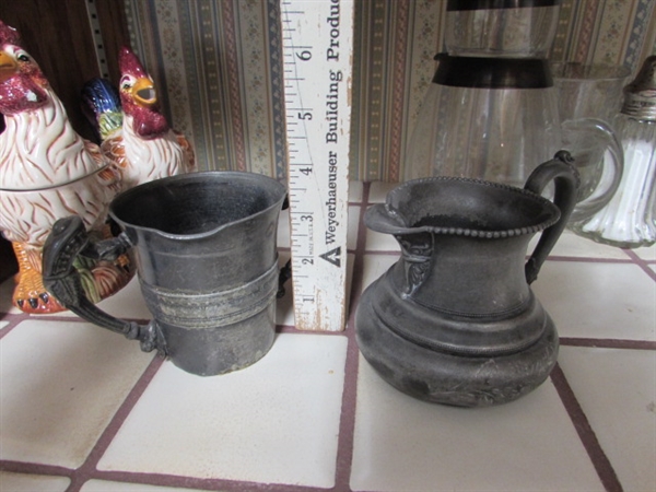 VINTAGE SILVERPLATE CREAMER, SALT & PEPPER SHAKERS, CERAMIC ROOSTERS, BRASS BULL HEAD SKEWERS & VINTAGE ROLY POLY GLASS PITCHER W/ONE GLASS