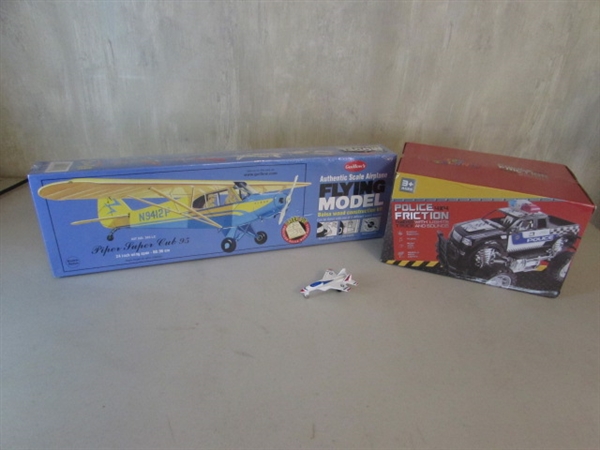 PIPER SUPER CUB 95 BALSA AIRPLANE KIT, POLICE 4X4 FRICTION POWERED TRUCK AND MINI DIE CAST AIRPLANE