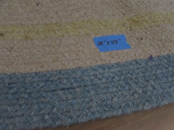 2 WOVEN OVAL RUGS