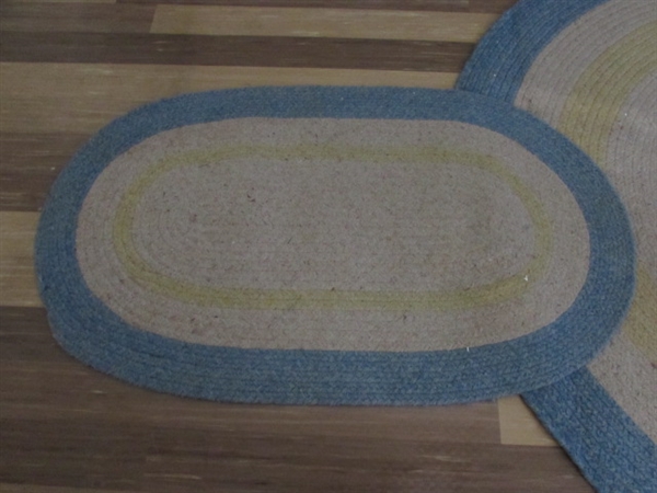 2 WOVEN OVAL RUGS