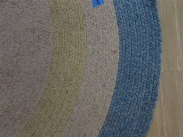 2 WOVEN OVAL RUGS