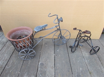 2 METAL DECORATIVE TRICYCLES, ONE WITH POT HOLDER